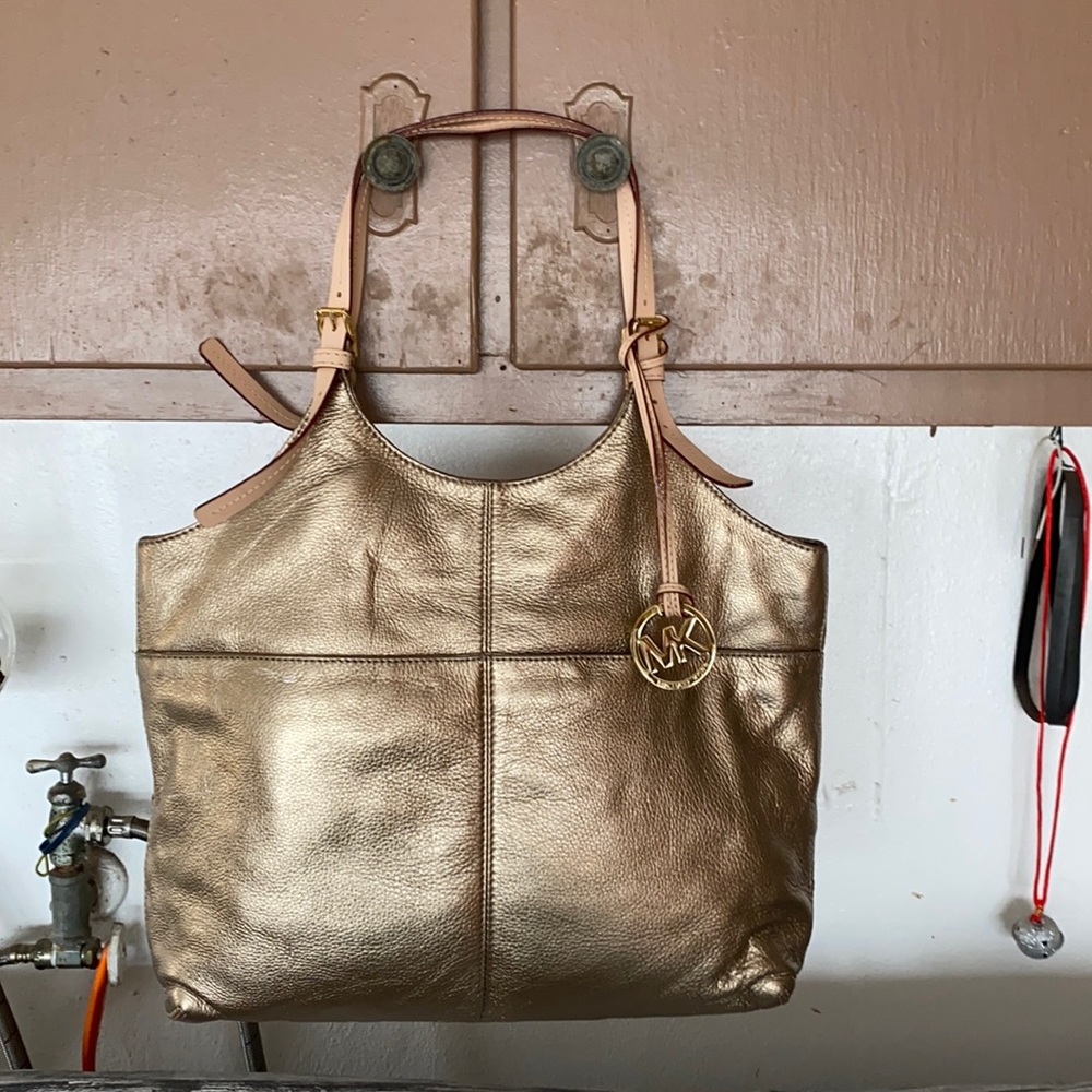 Michael Kors Gold two small scratches.